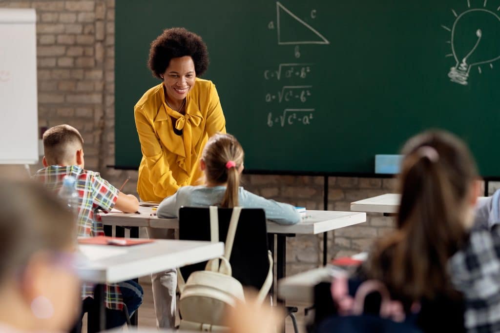 Teacher working with students in the classroom